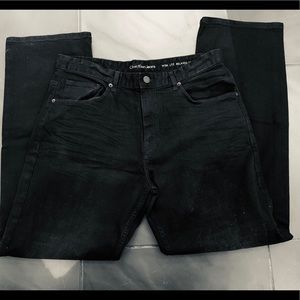 Calvin Klein Men’s black wash jeans .